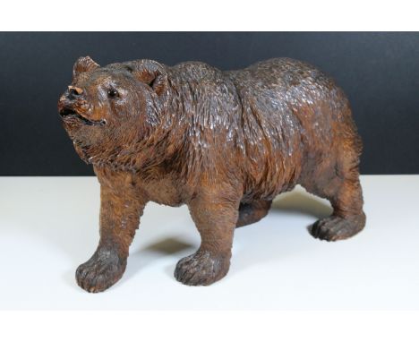Large 20th Century carved Black Forest wooden bear sculpture, measures approx 45cm long
