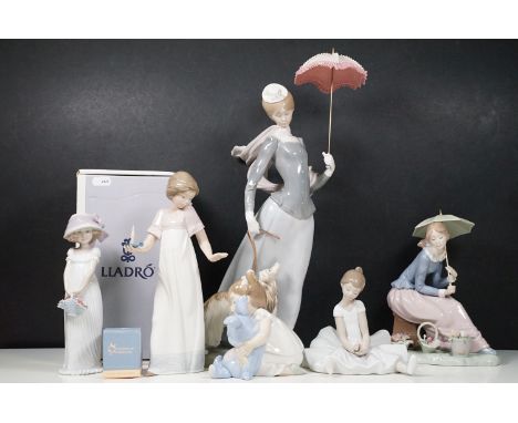 Group of Lladro and Nao figurines to include 'Little Lady', 'Seated lady with umbrella', 'Girl with toy rabbit', 'Seated ball