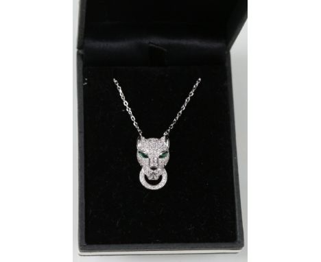 Silver and CZ leopard headed pendant with emerald eyes 