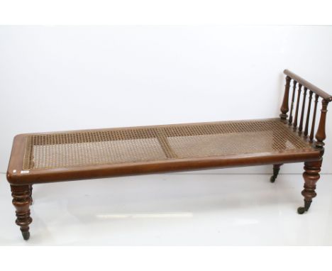 20th century woven cane seat day bed/ chaise lounge with rail, raised on turned legs and casters, H 43cm, W 170cm, D 57cm