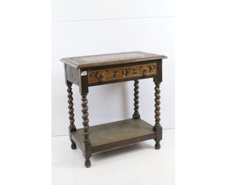 19th century oak hall side table with carved pattern to top and sides, raised on barley twist legs with lower shelf H 75cm, W