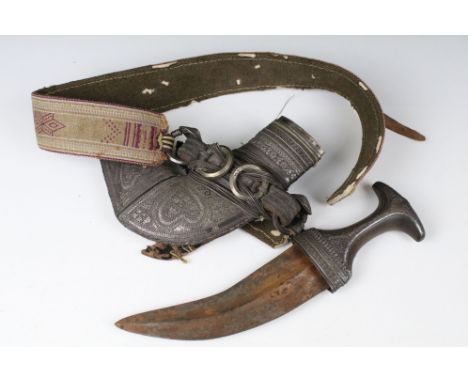 An Arabian dagger, Possibly Yemen, Late 19th century to early 20th century. Jambia or yambiya with its sheath in leather and 