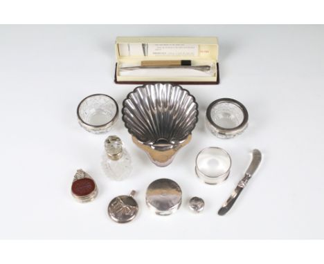 A collection of mixed fully hallmarked and contemporary 925 silver ware to include a scalloped dish, salts, sugar nips, napki