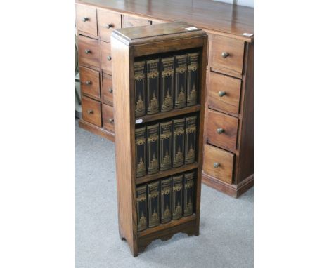 Early 20th Century oak bookcase of three shelves, containing 15 x Charles Dickens novels including Bleak House, Our Mutual Fr