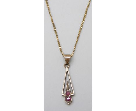 A fine 9ct gold chain, 1.2g, and a yellow metal and ruby pendant, 0.8g