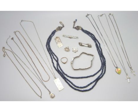 A collection of silver jewellery including pendants, a bracelet, brooches, etc., including a Georg Jensen St Christopher pend