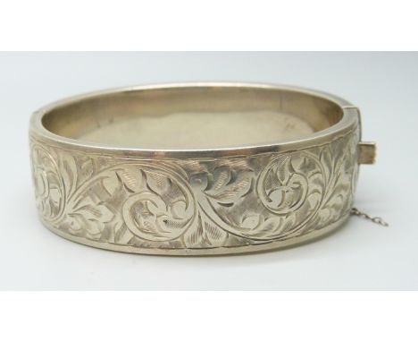 A vintage engraved silver bangle, lacking safety clasp, Birmingham 1946, 28g