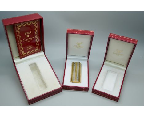 A Must De Cartier gold plated lighter, boxed, together with two empty Cartier boxes *This lot is not available for packing an