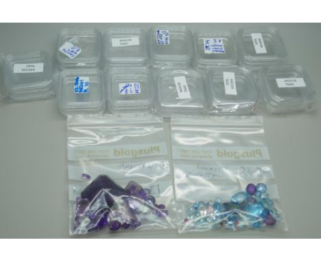 Gemstones - A collection of topaz, 93.85ct total, and amethyst, 134.55ct total
