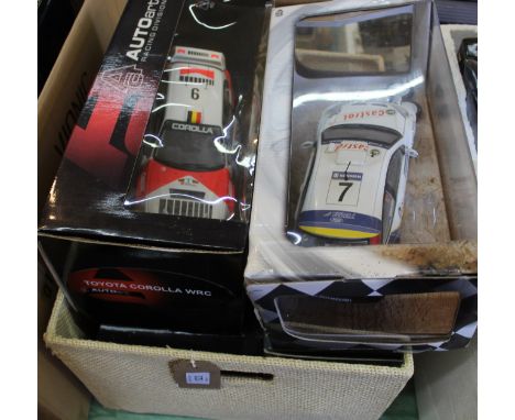 Four boxed large scale models, Autoart Peugeot 206 WRC, Burago Citron Xsara WRC, Autoart Corona WRC and Hot Wheel BP Ford Wor