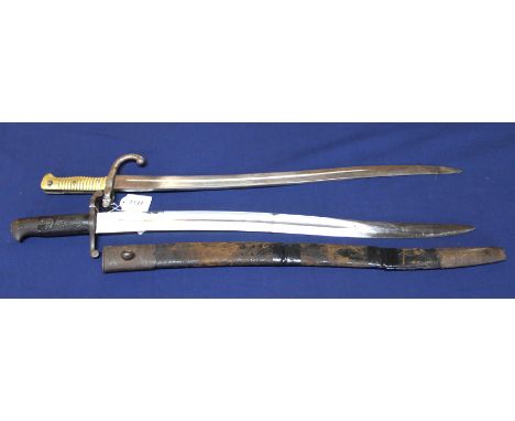 A British model 1856 sword bayonet (scabbard as found) with a brass hilted sabre bayonet marked A &amp; A.S. (no scabbard)