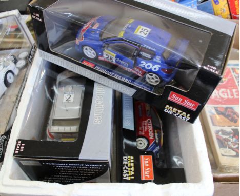 Four boxed Sunstar 1/18 scale rally cars, Citroen Xsara WRC Loeb, Elena Monte Carlo 2006, Citroen Xsara WRC Santz, Marti Cata