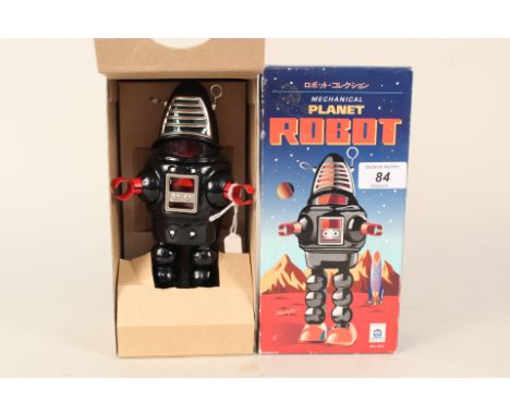 A boxed Ha Ha mechanical planet robot