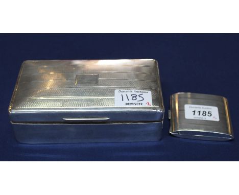 A silver (Birmingham 1929) travel clock with inscription H.M.S. Effingham East Indies, with silver (Birmingham 1928) also wit