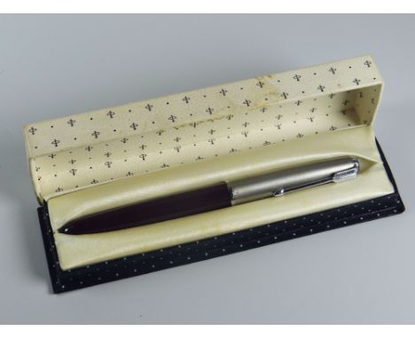 A VINTAGE BURGUNDY PARKER 51 FOUNTAIN PEN with lustraloy cap with chrome plated clip &amp; jewel, in original box with instru