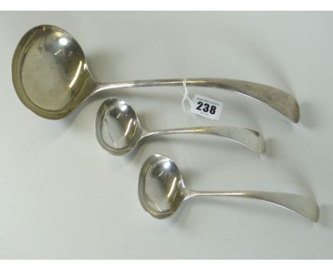 LARGE GEORGE V SILVER LADLE together with a pair of smaller silver ladles. All Sheffield 1924, W S Savage &amp; Co, 13 troy O