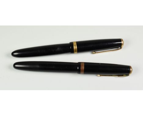 TWO VINTAGE BLACK PARKER DUOFOLD STANDARD FOUNTAIN PENS with 14ct gold nibs, one button fill, one converter