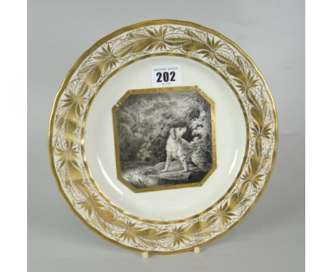 A DERBY PORCELAIN PLATE WITH SEPIA PANEL BY JOHN BREWER featuring a single dog within woodland in a gilt frame within a folia