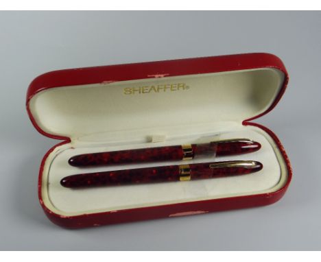 MODERN FLAME RED SHEAFFER CREST (REISSUE) FOUNTAIN PEN &amp; ROLLERBALL SET in red laque finish in the nova pattern with 23ct