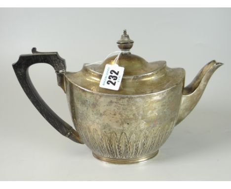 VICTORIAN SILVER OVAL TEAPOT having half body leaf decoration with ebonized handle and finial. Birmingham 1896, Elkington &am