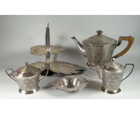 FIVE PIECE WHITE METAL TEA SET, comprising folding cake stand, teapot, cream jug, sucrier and bon bon dish, all profusely dec