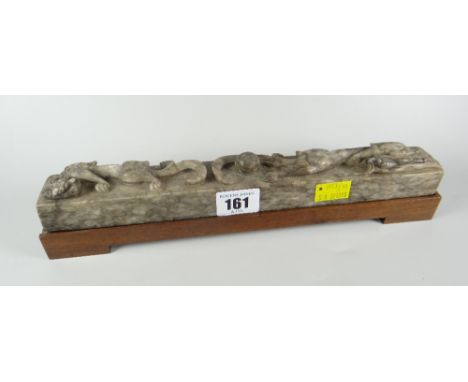 CHINESE HARDSTONE POSSIBLY NEPHRITE JADE SCROLL WEIGHT with dragon &amp; pearl decoration of rectangular form, raised on rect