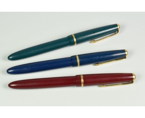 THREE VINTAGE PARKER SLIMFOLD FOUNTAIN PENS each with an original 14ct gold nib (blue, green &amp; red)