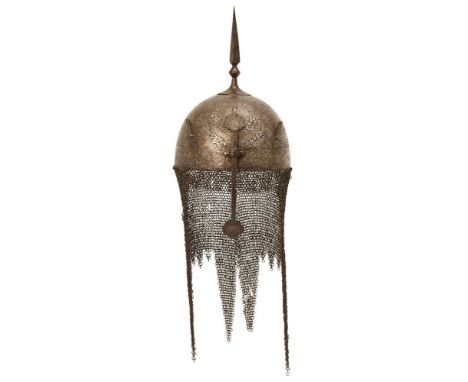 A Qajar gold damascened steel helmet and shield,Persia, 19th century, the helmet of domed form surmounted by a spike, the fro