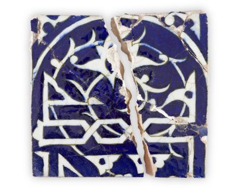 An Ilkhanid cobalt blue glazed Kufic pottery inscription tile, Iran, 14th century or later,of square form, underglaze painted