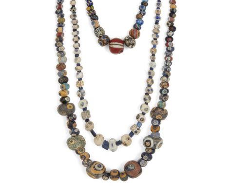 Two Eastern Mediterranean 'eye' bead necklacesCirca 5th-3rd Century B.C. and LaterA necklace composed of polychrome spherical