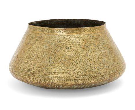 A large engraved brass basin in the Mamluk style, Egypt or Syria, 19th century, with flat base and tapering sides, engraved w