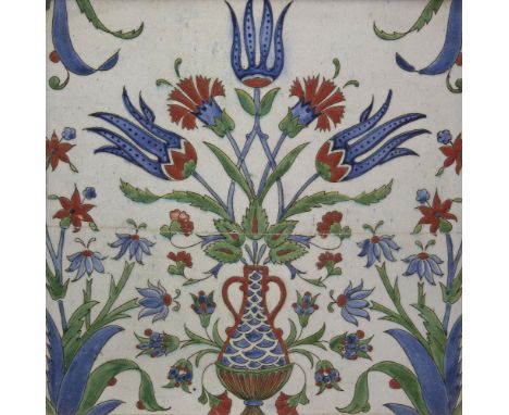 A European Iznik-style tile, France or Italy, 19th century, of square form, underglaze painted in cobalt blue, green and red 