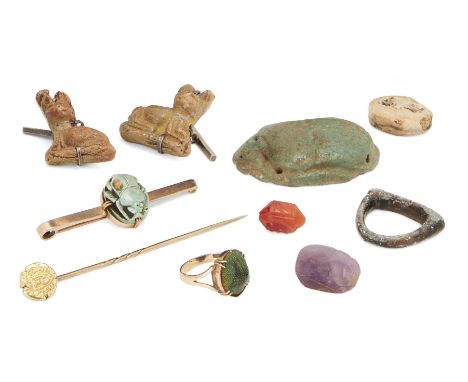 Three miscellaneous antiquitiesVarious PeriodsIncluding an Egyptian Middle Kingdom amethyst scarab, 19mm long;  a Neo-Assyria