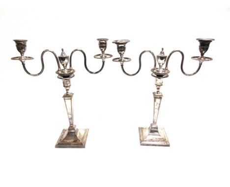 A PAIR OF ELECTROPLATE ON COPPER TWO LIGHT CANDELABRA square rising base, beaded borders, crested, 44cm high, 38cm across