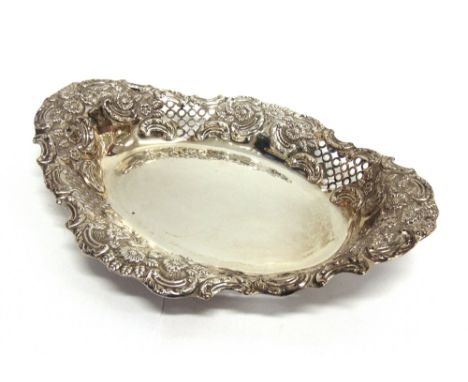 A LATE VICTORIAN SILVER OVAL BASKET  by Harrison Brothers & Howson, Sheffield 1899, of oval outline with embossed and pierced