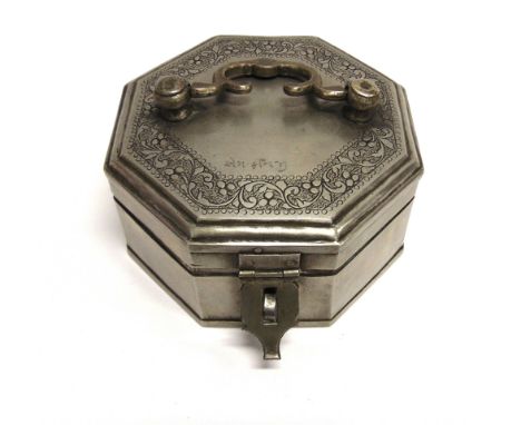 A WHITE METAL CADDY OF OCTAGONAL FORM  the hinged lid with carrying handle and foliate decoration opening to removable tray a