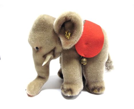 A STEIFF SOFT TOY ELEPHANT  22cm long.