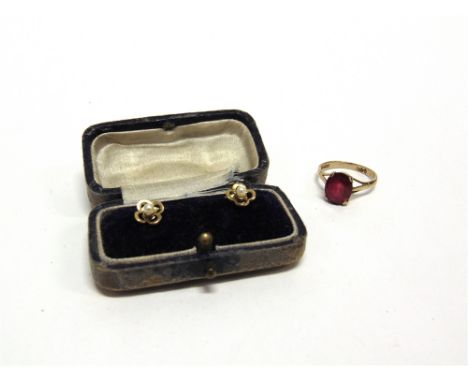 A 9 CARAT GOLD SYNTHETIC RUBY SINGLE STONE RING 2.3g gross; a pair of pearl dress studs, stamped '9ct', 2g gross, cased 