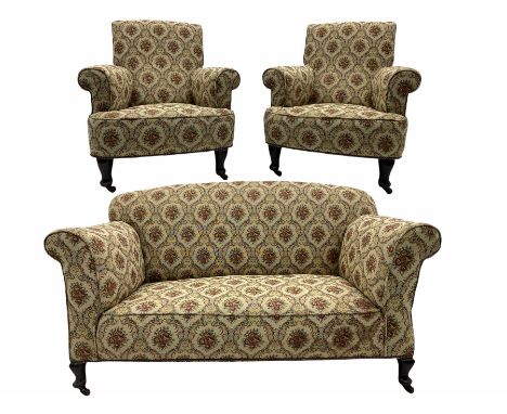 Early 20th century two seat drop arm sofa, and pair of matching armchairs, upholstered in beige patterned fabricDimensions: H