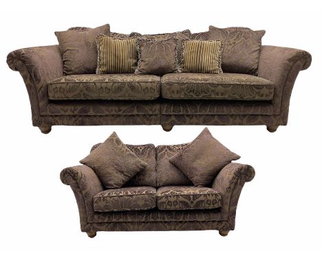 Three seat sofa (W180cm), and matching two seat sofa (W242cm), upholstered in plum fabric decorated with raised floral repeat