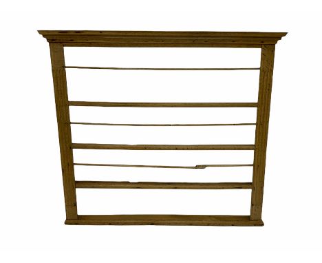18th century light oak wall hanging four heights plate rack, moulded projecting cornice over fluted uprightsDimensions: Lengt