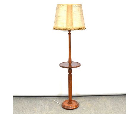 Mahogany standard lamp, turned column with central table, circular base, with "indenture" shade, height overall 178cm.