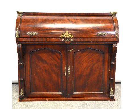 Victorian mahogany rolltop desk, fitted interior above a cupboard, plinth base, brass mounts, width 109cm, depth 50cm, height