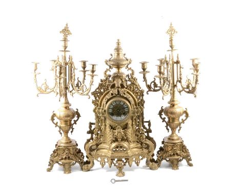 Large French cast brass clock garniture, the clock with vase surmount, the German cylinder movement striking on a bell, 60cm,