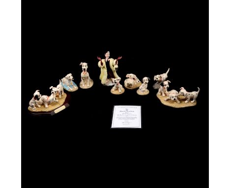 Royal Doulton, nine figurines from Disney's 101 Dalmatians series including:DM5, Patch, Rolly &amp; Freckles #3155, on wooden