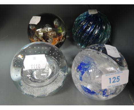 A selection of Caithness paper weights including Optic and Seadance