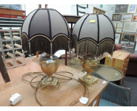 A pair of vintage brass urn style table lamps