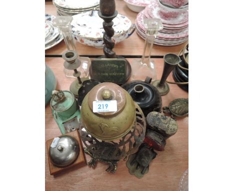 A selection of hardware including cycle lamp and footed trivet