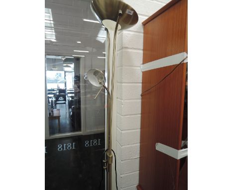 A modern brushed brass effect, uplighter/reading style standard lamp