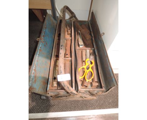 A vintage tool box and contents